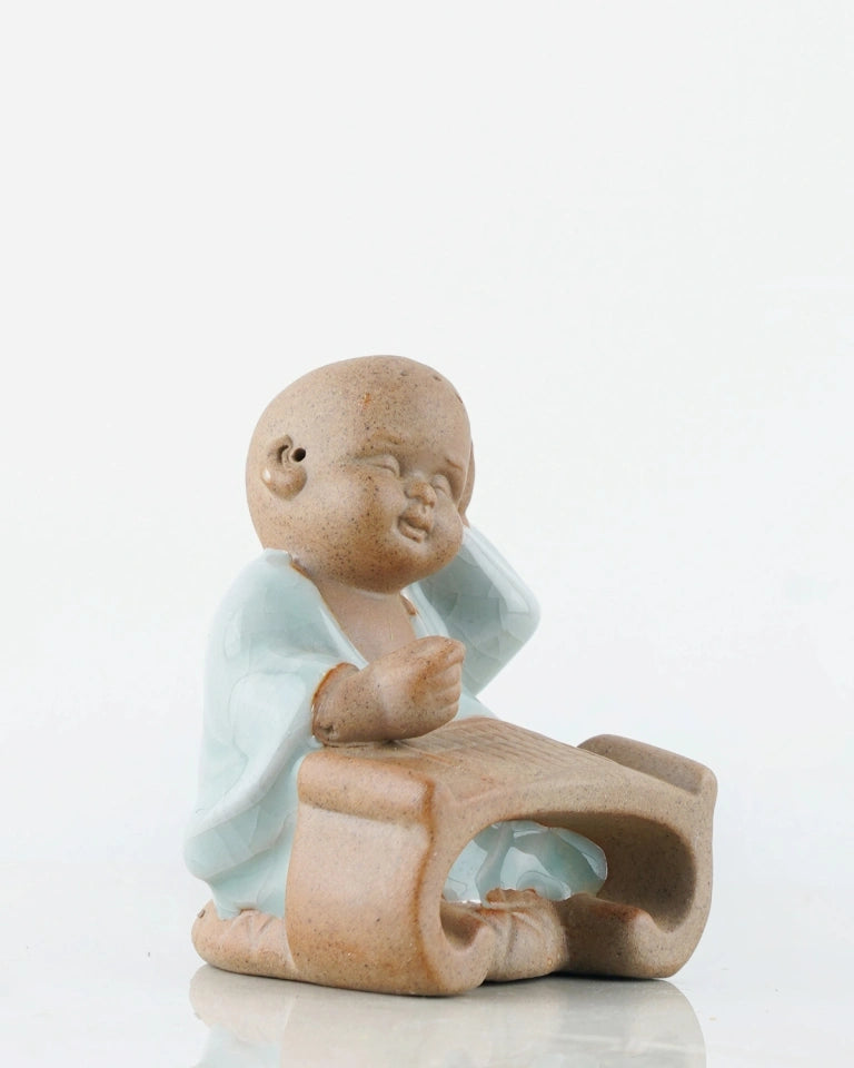 Studying Monk home decor India - Unlimited Greens